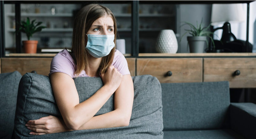 sad woman wearing a mask